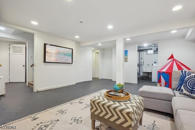 living room featuring concrete flooring and recessed lighting