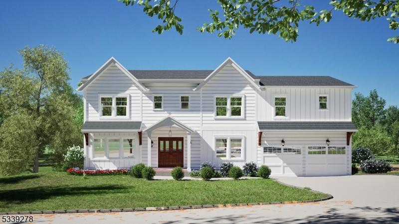 view of front of house with board and batten siding, a front yard, concrete driveway, and an attached garage