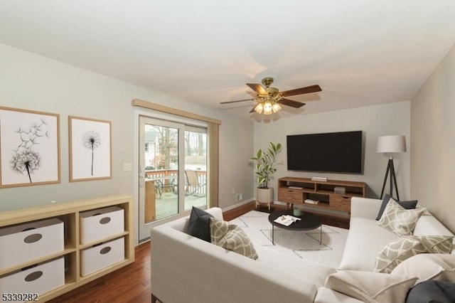 living area featuring dark wood finished floors and a ceiling fan