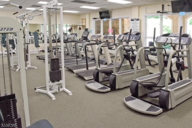 workout area with a paneled ceiling