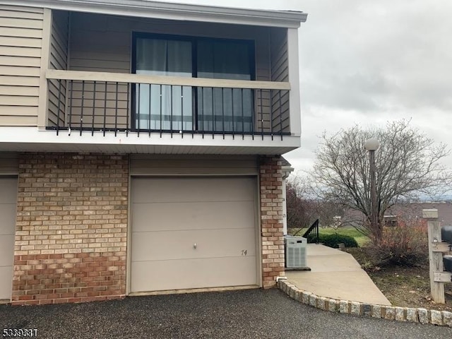 garage featuring aphalt driveway