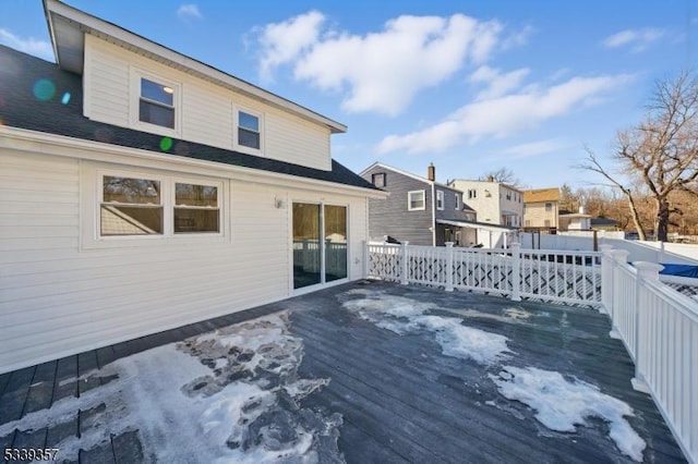 wooden terrace with a residential view