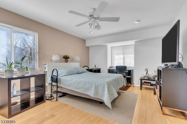 bedroom featuring a ceiling fan and light wood-type flooring