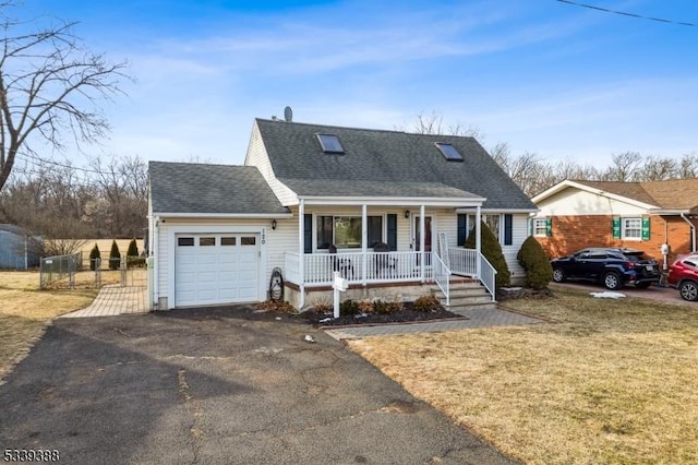 view of front of property with a porch, a shingled roof, a garage, driveway, and a front lawn