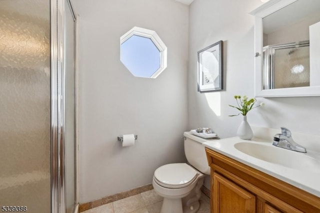 bathroom with toilet, a stall shower, tile patterned flooring, and vanity