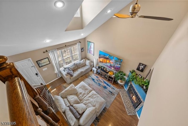 living room featuring ceiling fan, wood finished floors, and recessed lighting