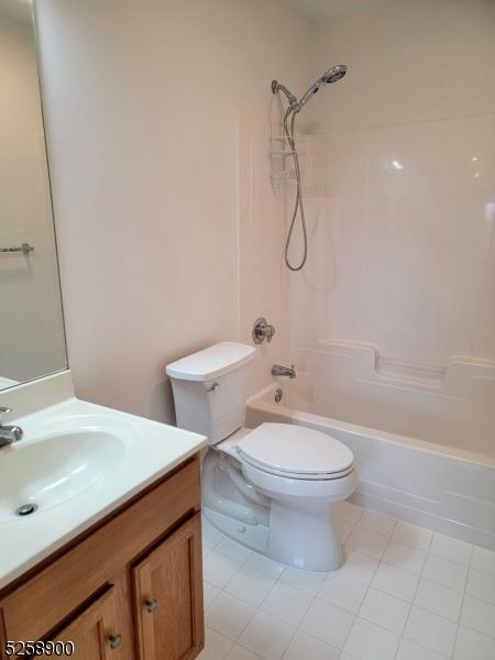 full bathroom with toilet, shower / tub combination, and vanity