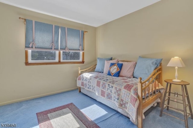 carpeted bedroom with baseboards