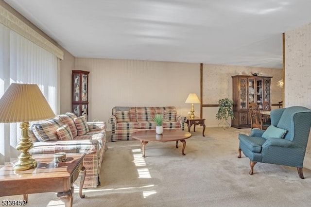 living room with carpet flooring and wallpapered walls