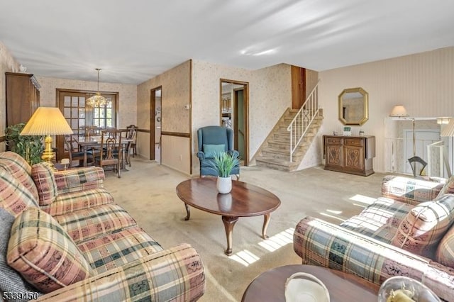 living room with wallpapered walls, stairway, and carpet