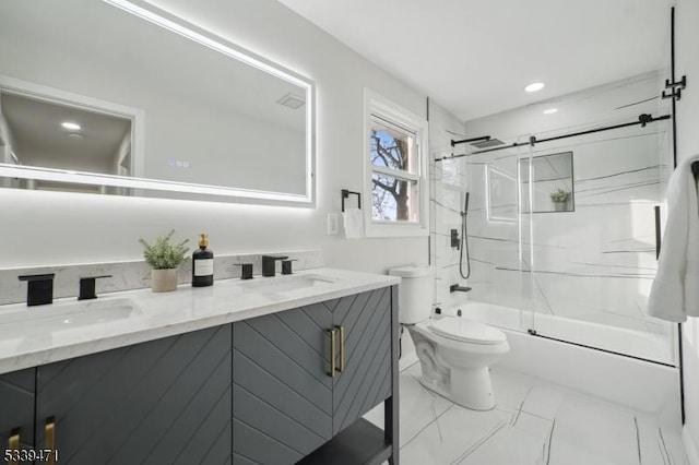 full bath with double vanity, a sink, marble finish floor, and bath / shower combo with glass door