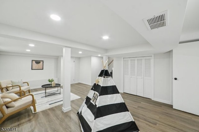 sitting room featuring recessed lighting, visible vents, and wood finished floors