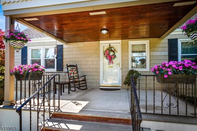 doorway to property with covered porch