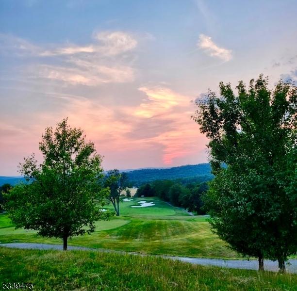 view of community featuring view of golf course