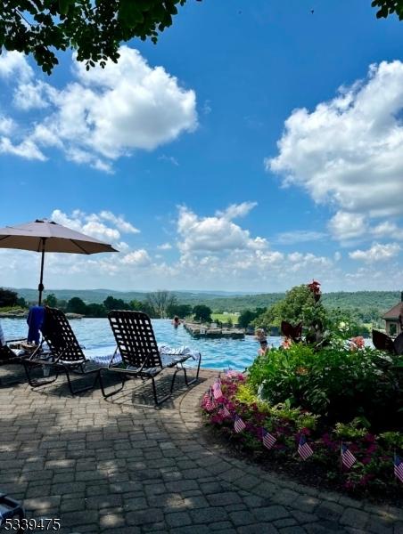 view of swimming pool featuring a water view