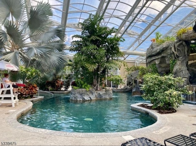 pool featuring a lanai and a patio