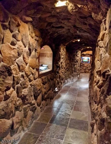 wine room featuring stone finish flooring