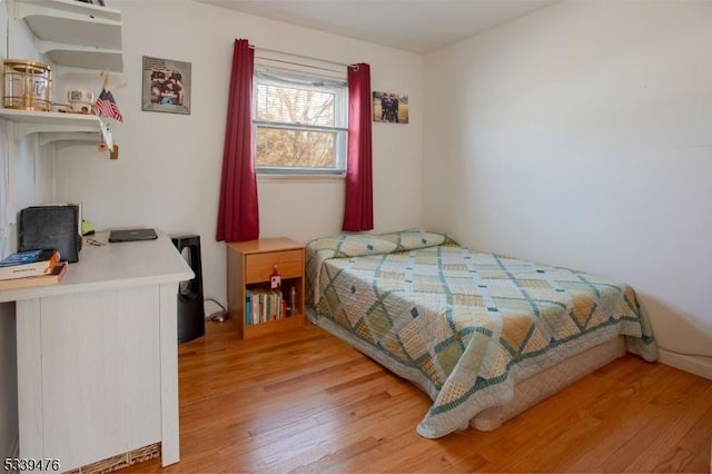 bedroom featuring light wood-style flooring