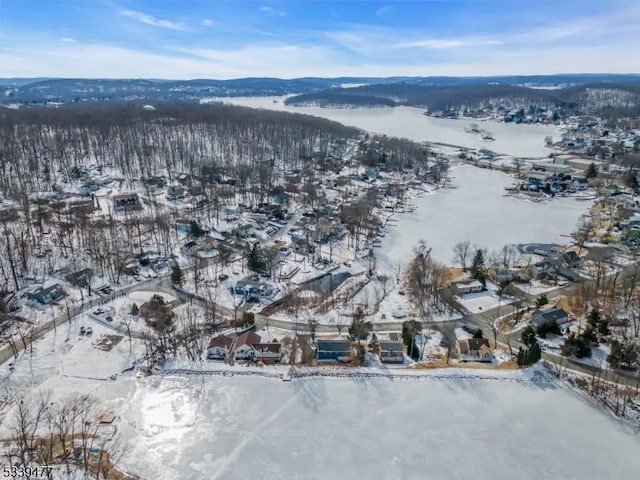 snowy aerial view featuring a residential view