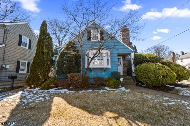 view of front of property featuring a chimney