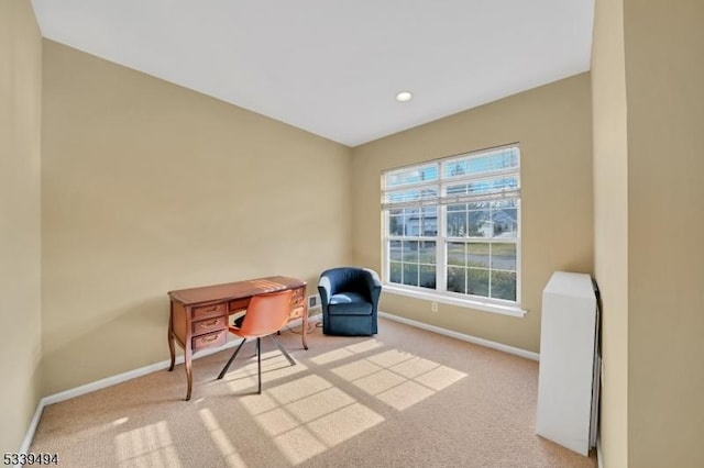 sitting room featuring recessed lighting, light colored carpet, and baseboards