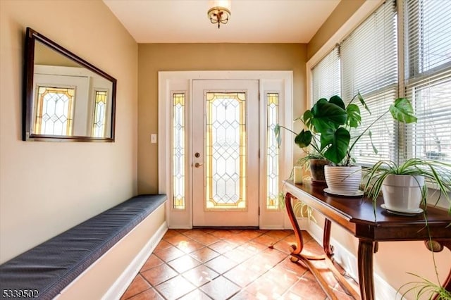 foyer featuring light tile patterned floors