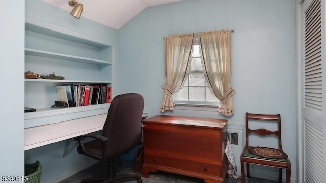 office area with vaulted ceiling