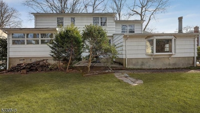 back of house featuring crawl space and a yard