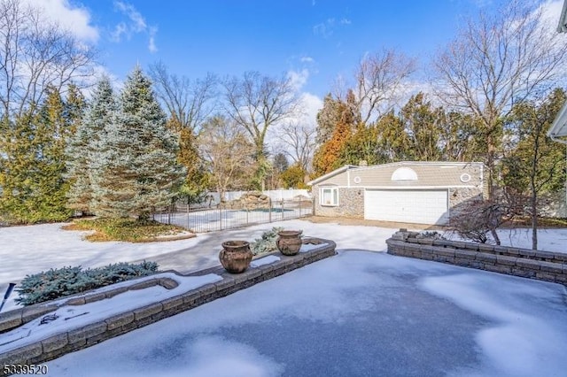 snow covered pool with fence