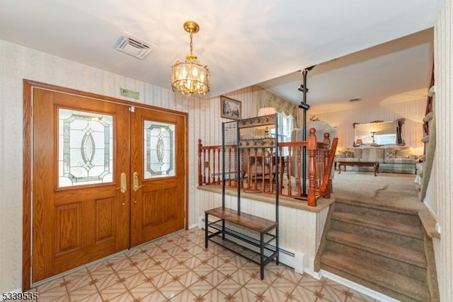 entrance foyer with a baseboard radiator, visible vents, stairway, a chandelier, and wallpapered walls