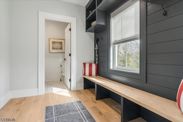 mudroom with light wood-style flooring and baseboards