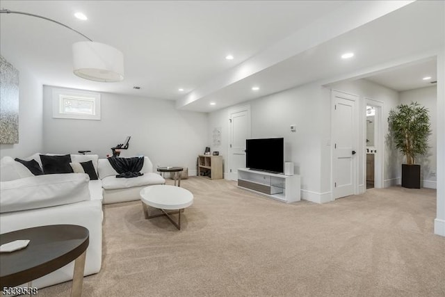 living area featuring light carpet, baseboards, and recessed lighting