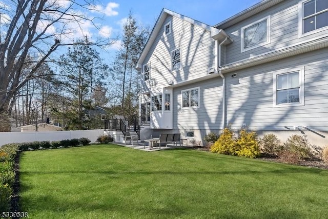 exterior space with fence and a yard