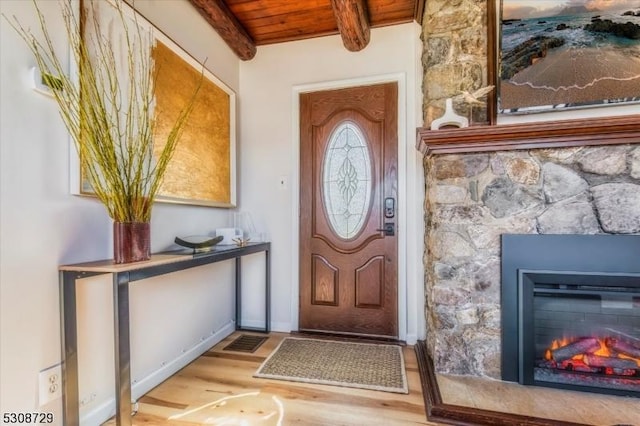 property entrance with visible vents and a fireplace