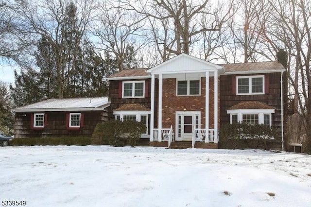 greek revival house featuring a chimney