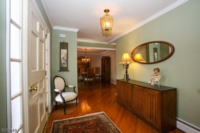 interior space featuring arched walkways, a notable chandelier, baseboard heating, dark wood-type flooring, and ornamental molding