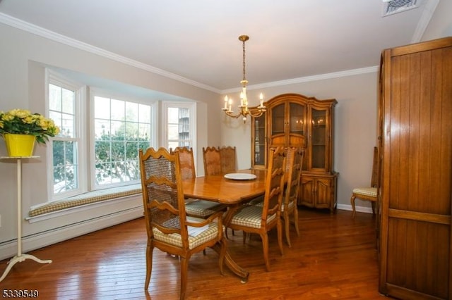 dining space featuring visible vents, dark wood-style floors, baseboard heating, crown molding, and a notable chandelier