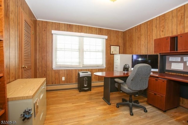 home office with a baseboard heating unit, light wood finished floors, a baseboard radiator, and crown molding