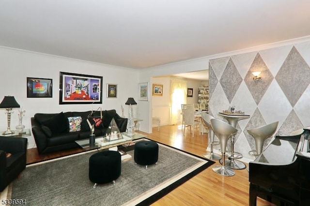 living room featuring ornamental molding and wood finished floors