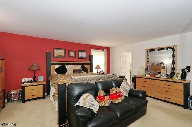bedroom featuring light carpet