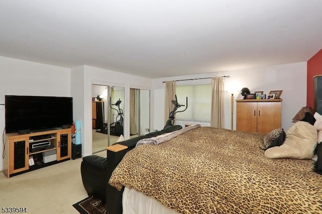 bedroom featuring light colored carpet