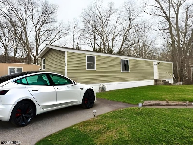 view of home's exterior featuring a yard