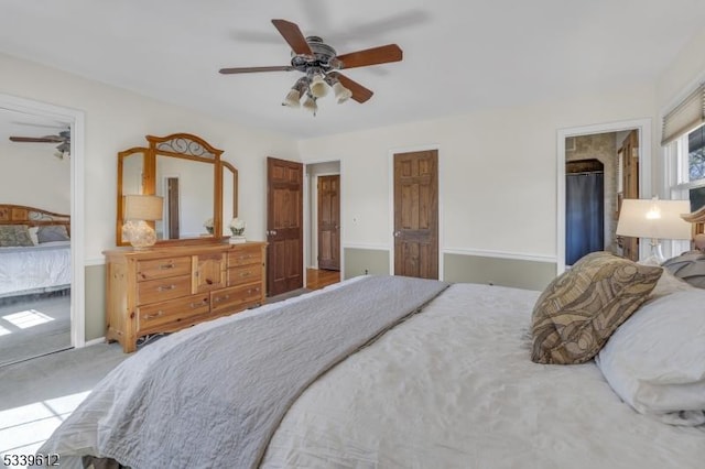 bedroom with a ceiling fan, carpet flooring, and baseboards