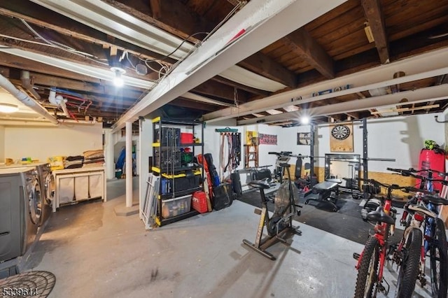 unfinished basement with washer and clothes dryer