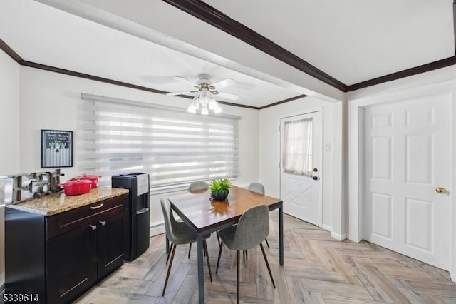 dining room featuring a ceiling fan and crown molding