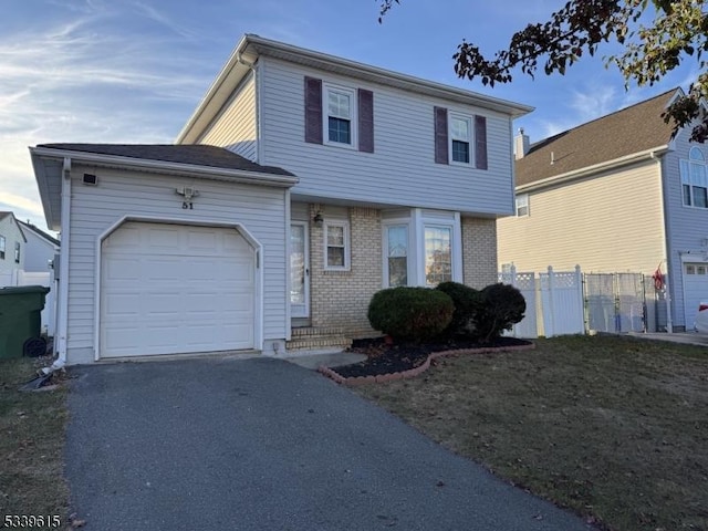 view of front of property featuring a garage, brick siding, fence, and driveway