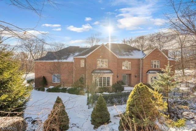 view of front of home featuring fence