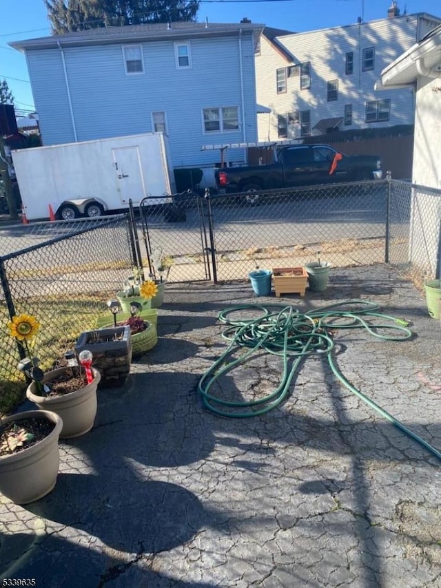 view of parking / parking lot with fence