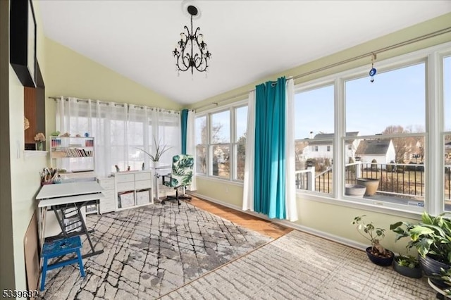 home office featuring vaulted ceiling, a notable chandelier, and baseboards