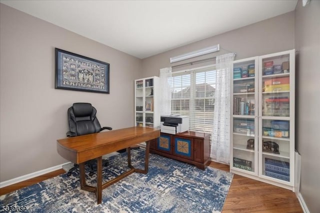 office area featuring wood finished floors and baseboards